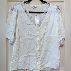 NWT white blouse. Size XL but runs a bit small.